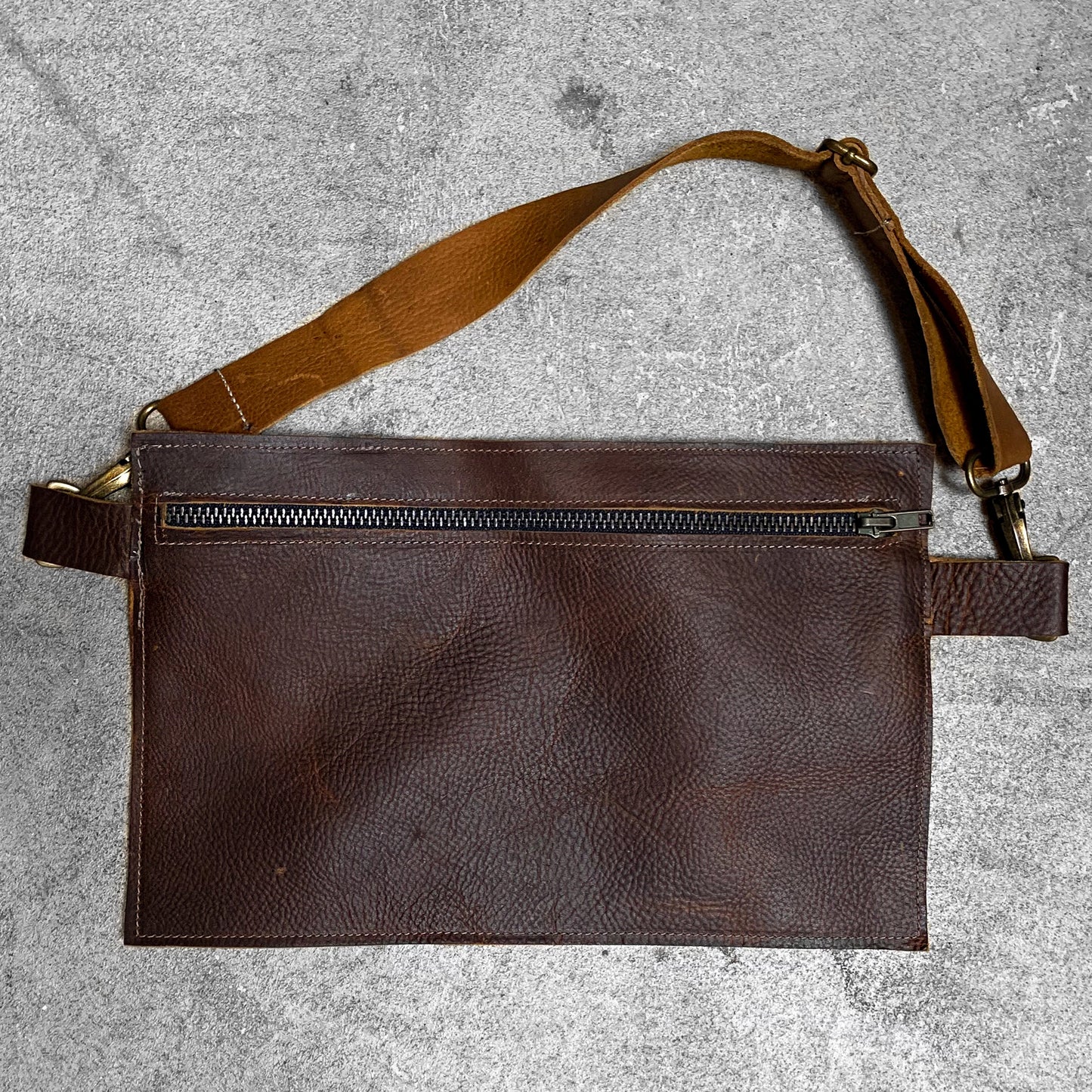Zipper Belt Bag in saddle with antique brass fasteners.