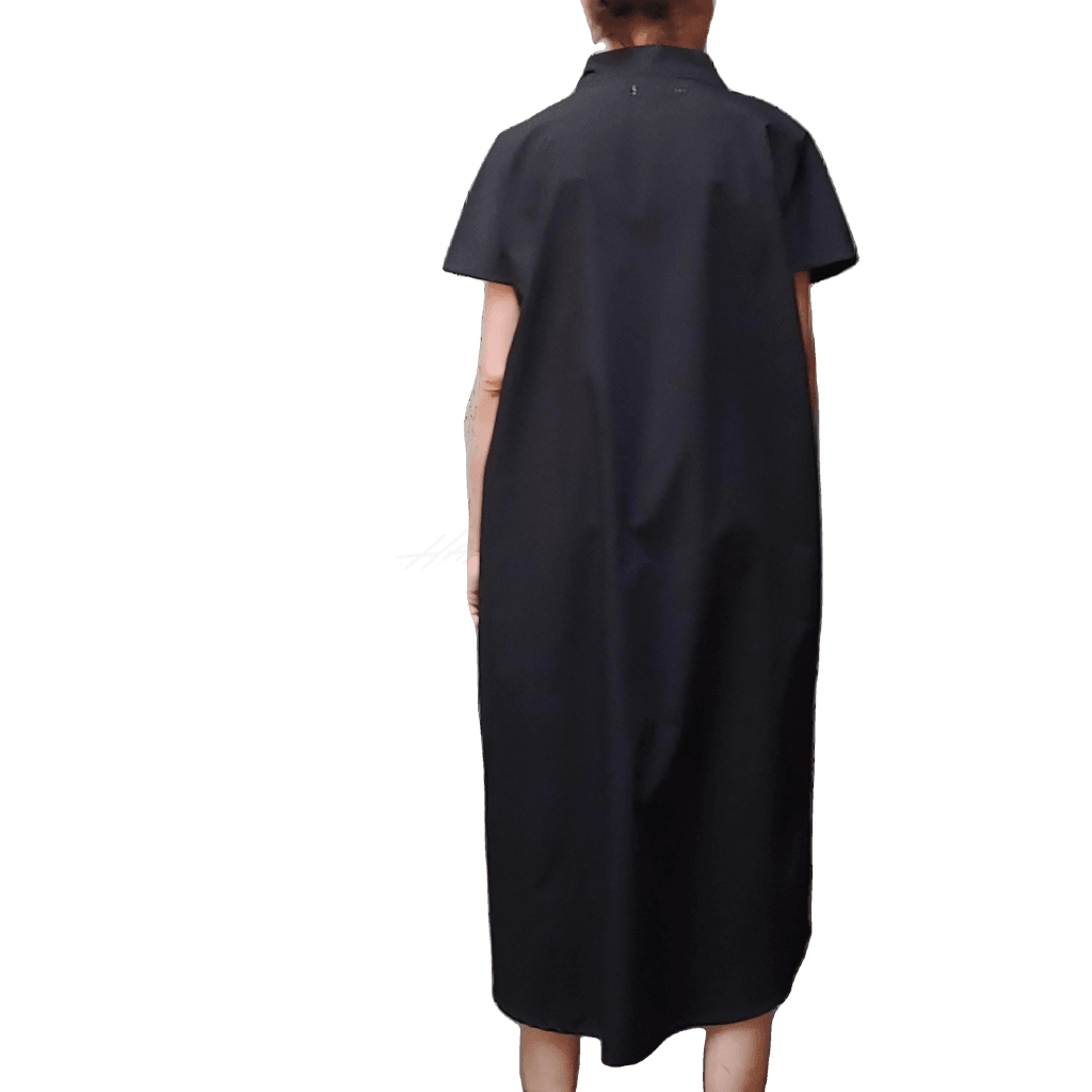 Back view of model in McCULLOUGH High Low Henley Tunic in black linen at Harkensback.