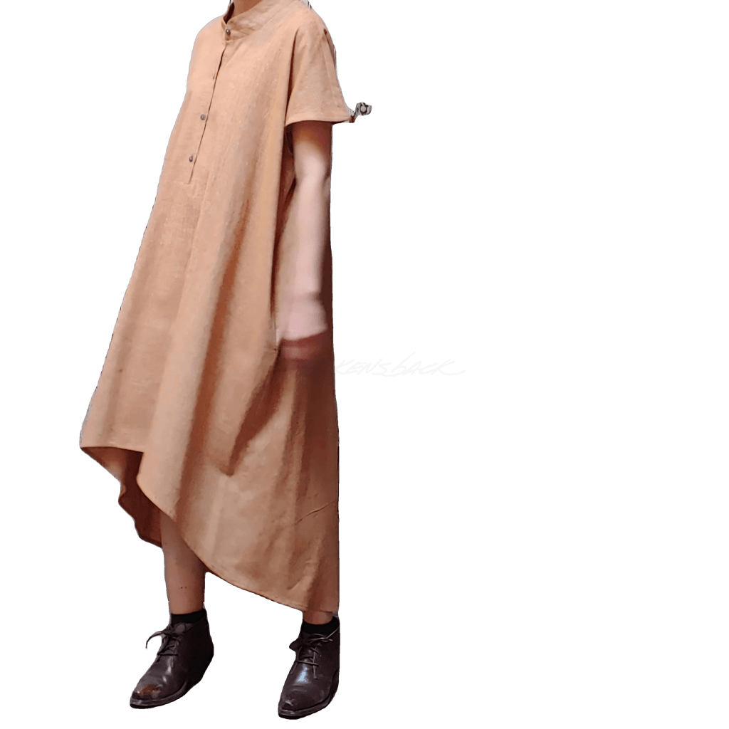 Partial side view of model in McCULLOUGH High Low Henley Tunic in roasted pecan textured linen. Photo taken at Harkensback.