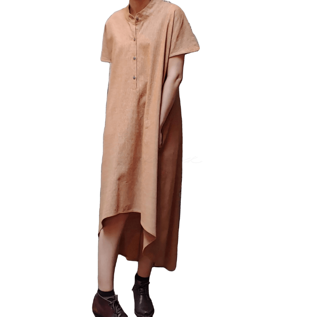 Model in McCULLOUGH High Low Henley Tunic in roasted pecan textured linen. Left hand hides in side-seam pocket.
