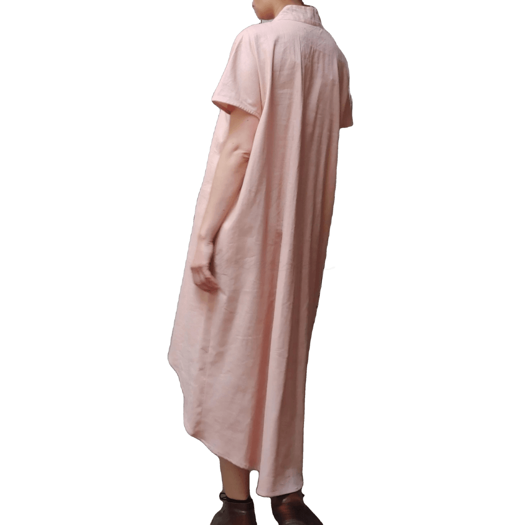 Back view of model in McCULLOUGH High Low Henley Tunic in rose linen at Harkensback.