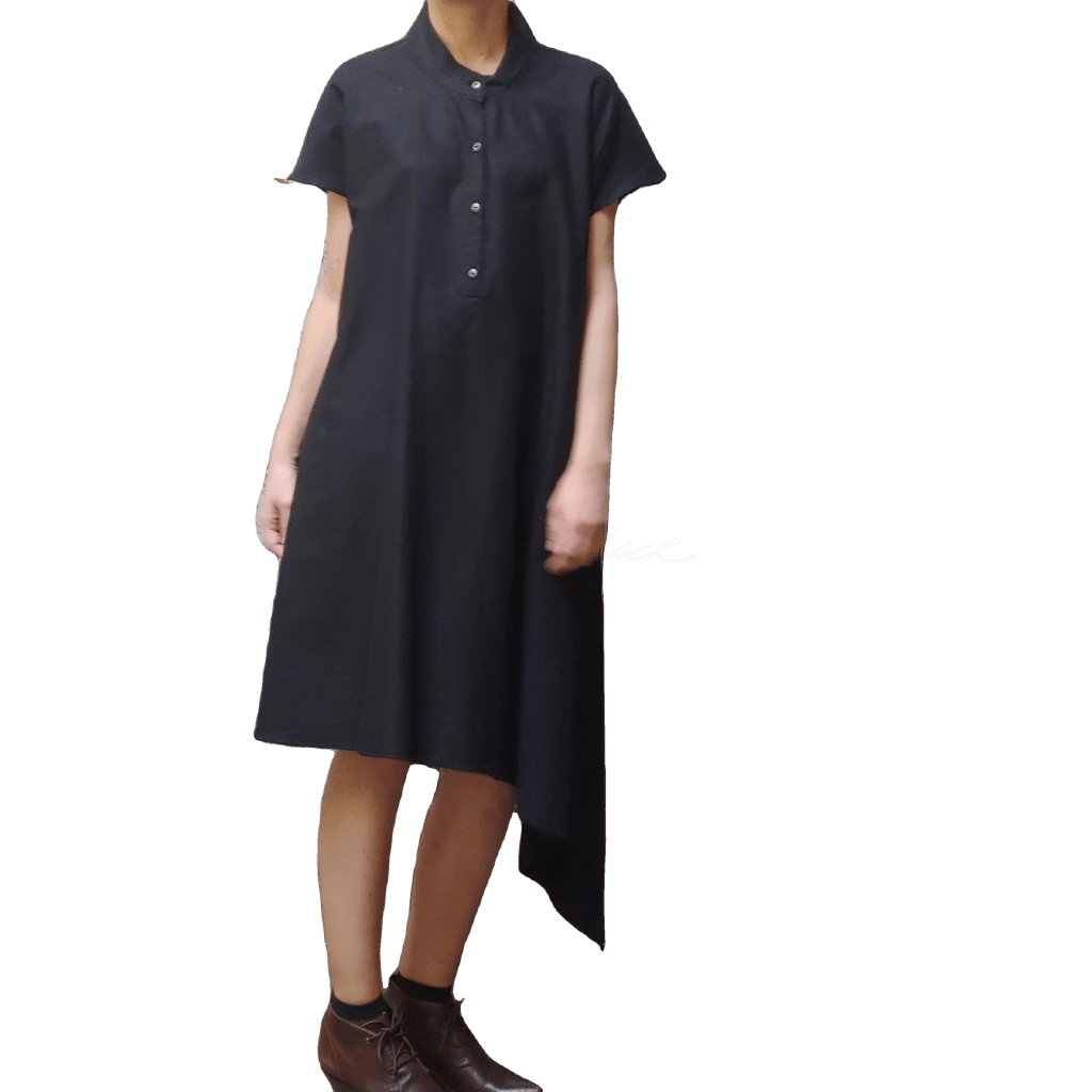 Model in McCULLOUGH Short Sleeve Asymmetric Henley Tunic in black linen at Harkensback.