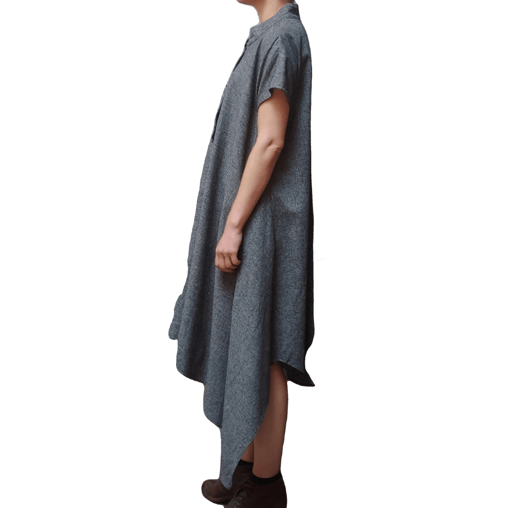 Side view of model in McCULLOUGH Short Sleeve Asymmetric Henley Tunic in gray linen at Harkensback.