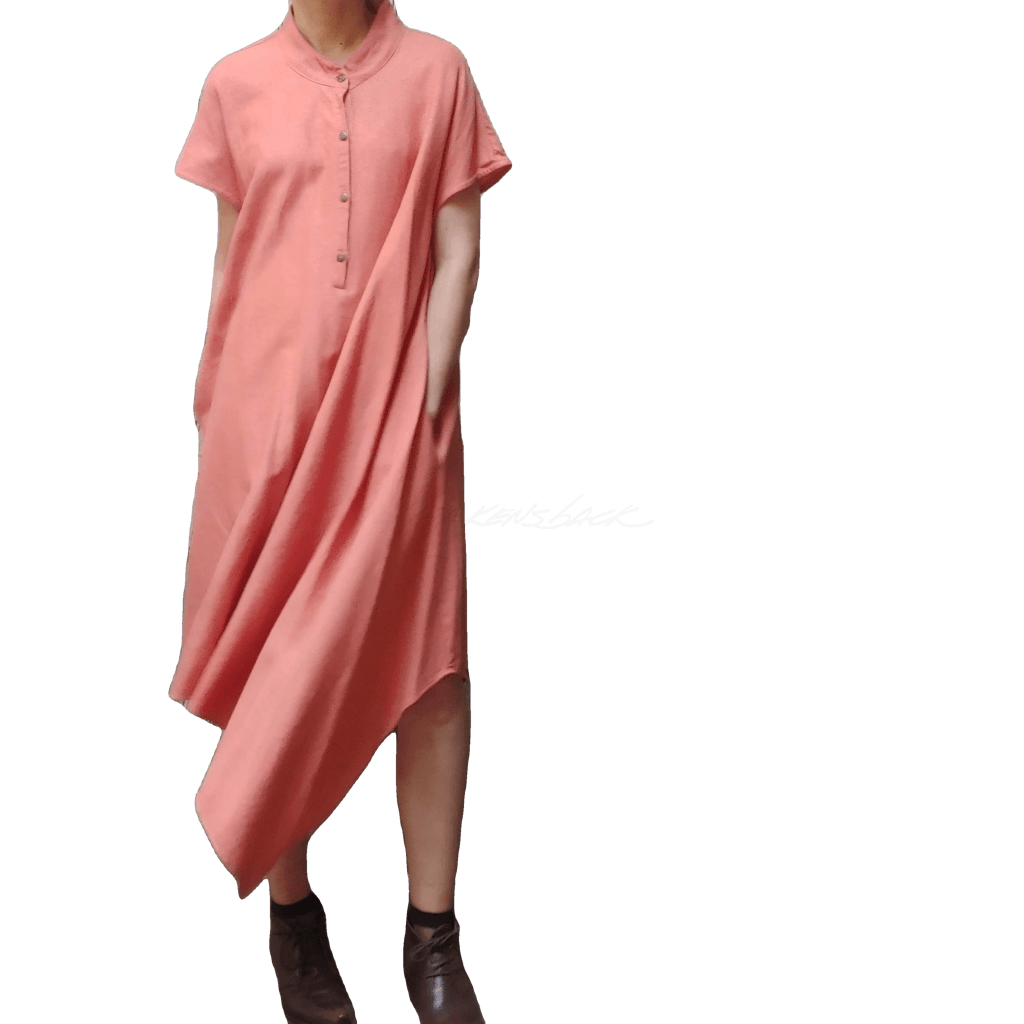 Model in McCULLOUGH Short Sleeve Asymmetric Henley Tunic in coral linen at Harkensback.